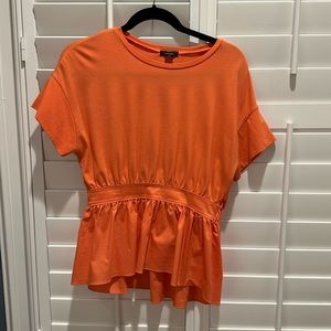 Orange peplum top